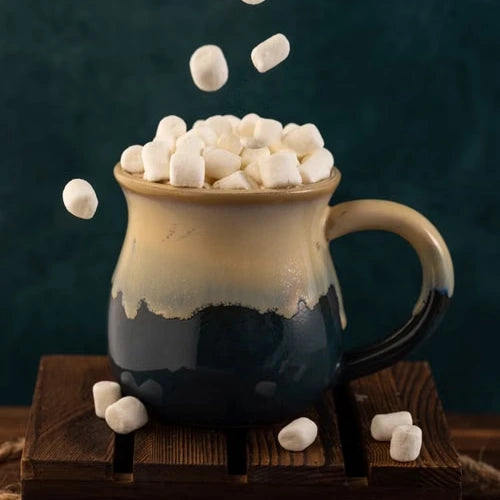 Marshmallows above a mug of hot chocolate — illustrative serving or coffee study